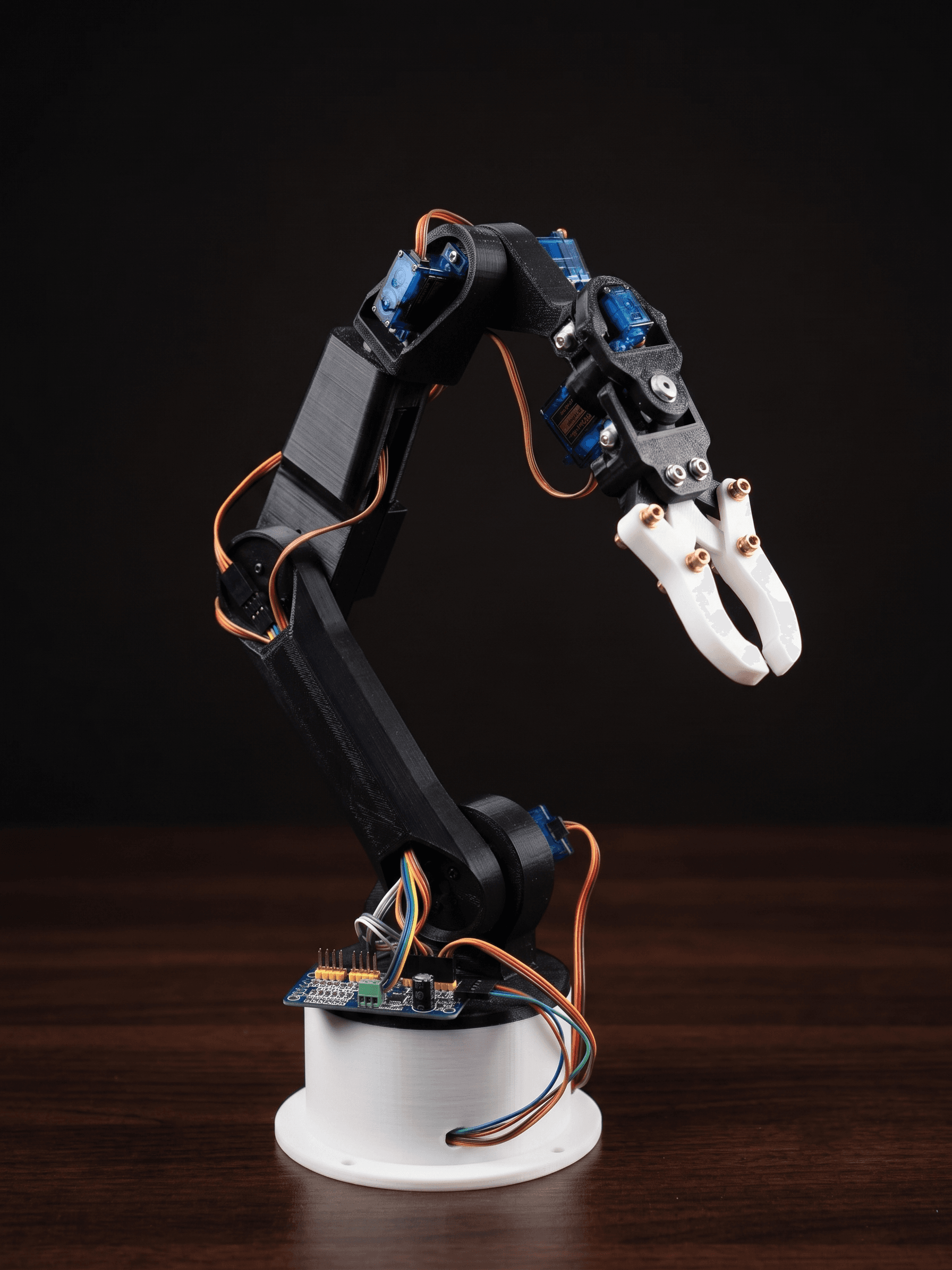 Dum-E is a self-designed 6-DOF robotic arm built around the XIAO ESP32 S3, featuring a WiFi-hosted web UI for real-time servo control and a custom glove controller using ESP-NOW wireless communication, an MPU6050 IMU, and flex sensors for intuitive gesture-based operation.